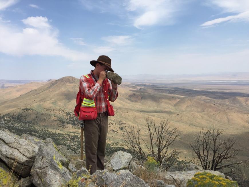 Examining rocks in the field.