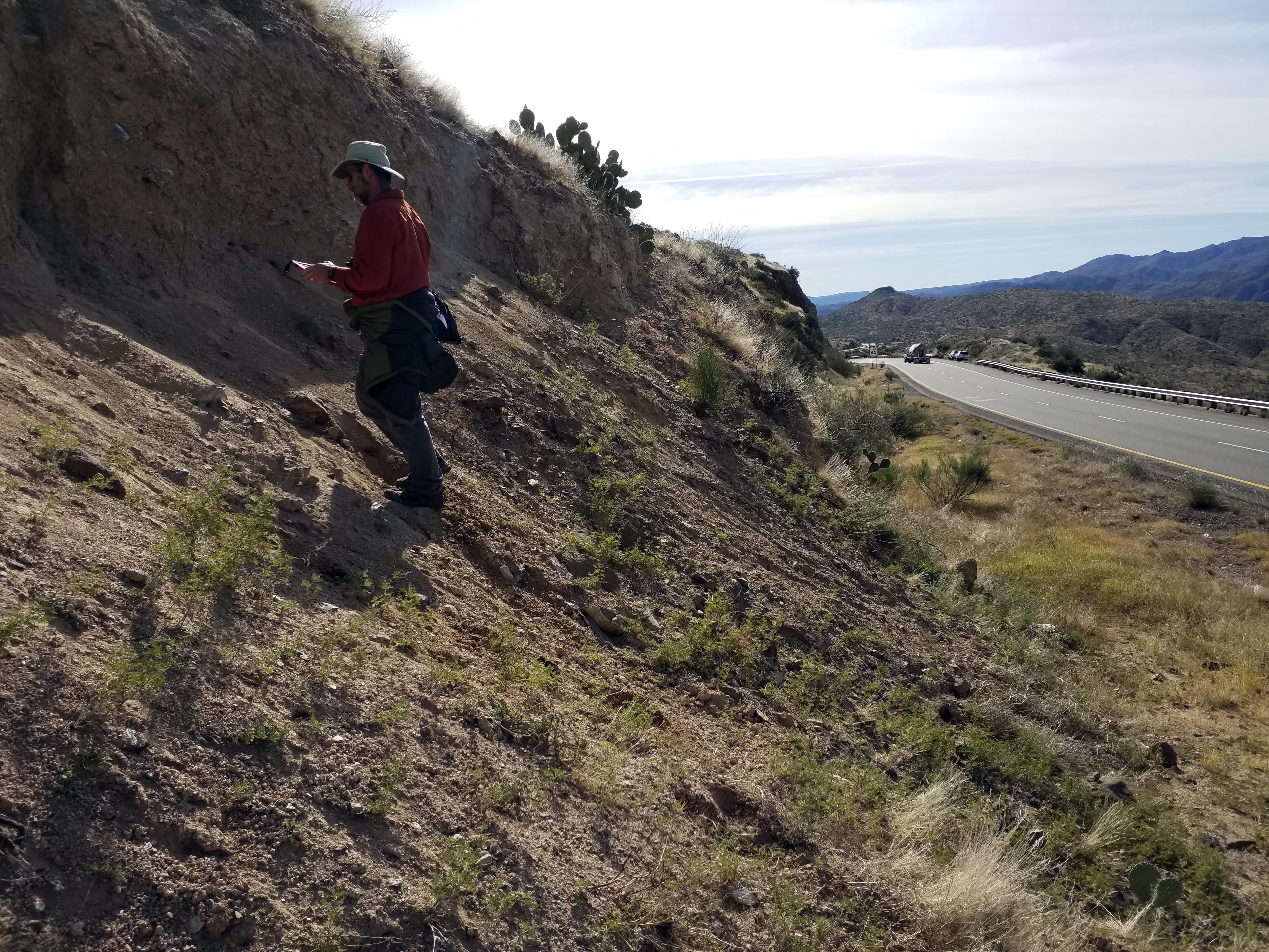 B. Gootee examining landslide deposits near Sunset Point. 